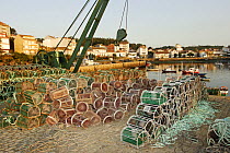 Lobster / crab pots and crane on the harbourside, Costa da Morte, Galicia, Spain