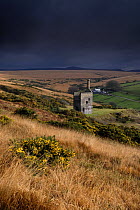 Dark rain clouds above ruin of Wheal Betsy tin mine, nr Mary Tavy, Dartmoor NP, Devon, UK.