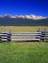Fence with Sawtouth Mountains behind, Sawtooth NRA, Idaho, USA