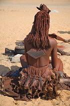 Woman of the Himba tribe, Kaokoland, wearing distinctive headdress and clothing. Namibia 2007