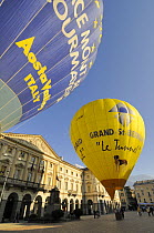 Hot air balloons preparing for take-off in the centre of Aosta City, northern Italy
