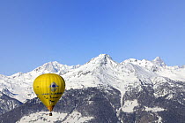 Hot air balloon in flight over the Aosta Valley region of the northern Italian Alps. This is the "Roof of Europe": Mont Blanc is the peak on the left, Grande Jorassos is the peak on the right