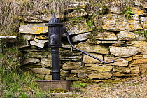 Old village waterpump in Naunton, Gloucestershire, UK