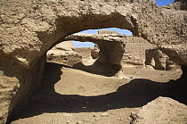 Stone archways in Jiaohe City, near Turpan in Xinjiang Province, North-west China. Once a thriving Silk-Road city, Jiaohe is now a World Heritage Site. July 2006, BBC "Wild China" series