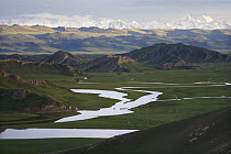 Watery landscape with scattered Mongolian Yurts at Swan Lake (also known as Bayanbulak) in Xinjiang Province, North-west China. June 2006, BBC "Wild China" series