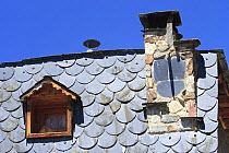 Slate tile roof and chimney in the Pyrenees mountains. Catalonia, Lerida, Spain