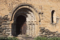 Entrance doorway of the Romanesque church of Alos dIsil in the Pyrenees mountains. Catalonia, Lerida, Spain
