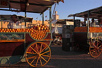 Market stalls selling orange juice in Djemaa el Fna square, Marrakech, Morocco December 2007