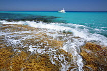 Sea rushing over rocks on the Es Caló coast, Formentera, Balearic Islands