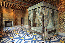 A grand four-poster bed in a bedroom of the Castle of Blois, Loire Valley, France