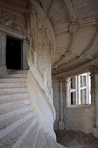 White stone spiral staircase in the Castle of Blois, Loire Valley, France