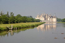 Castle of Chambord reflected in river. Loire Valley, France