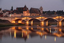 Bridge over the river at Amboise lit up at dusk. Loire Valley, France