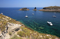 Boats moored in a bay in Columbretes Island Natural Park, Castellon, Spain