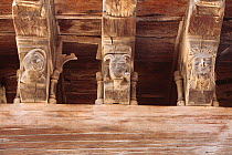 Beam detail with wooden gargoyle sculptures in Mirepoix, France