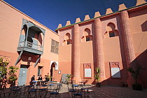 Tourists relaxing in the courtyard of the Museum of Marrakech, Morocco December 2007