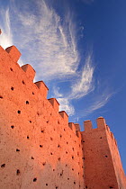 Looking up at the high fortified walls of the Medina in Marrakech, Morocco December 2007