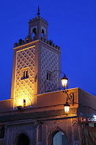 The tower of a Mosque in Djemaa el Fna square lit up at night. Marrakech, Morocco December 2007
