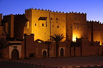 Kasbah of Taourirt lit up at dusk, Ouarzazate, Morocco December 2007
