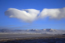 Cloud formations at dawn near Shuanghu town in Tibet's Chang Tang Nature Reserve. As the second largest Nature Reserve on earth, it is China's greatest natural asset. December 2006,