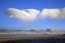 Cloud formations at dawn near Shuanghu town in Tibet's Chang Tang Nature Reserve. As the second largest Nature Reserve on earth, it is China's greatest natural asset. December 2006