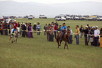 Mongolian children riding at the annual Nadam horse race, Inner Mongolia. June 2006