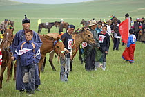 Mongolian horses and jockies before the annual Nadam horse race, Inner Mongolia.  June 2006.