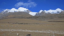 Snow capped peaks viewed from a mountain pass north of Lhasa, Tibet. December 2006