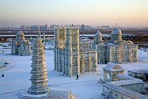 The Harbin Ice Festival, Heilongjiang Province, ice sculptures at dawn. A whole ice city is built in 18 days by 10,000 people from blocks of ice from the Songhua River. Each block has a neon light run...
