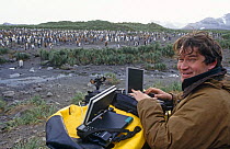 Alastair Fothergill, Producer, at Penguin colony in South Georgia with satellite link-up to BBC NHU in Bristol, UK, January 1998