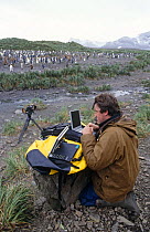 Alastair Fothergill, Producer, at Penguin colony in South Georgia with satellite link-up to BBC NHU in Bristol, UK, January 1998