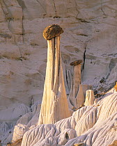 Wahweap Hoodoos, Utah. These cap-rock pinnacles have been formed by the erosion of the softer Entrada sandstone layers beneath the harder Dakota sandstone cap-rock