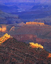 Jagged buttes catch the last light as the sun sets at Grandview Point, Grand Canyon National Park, Arizona