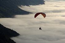 Paragliding above the clouds in the Swiss Alps. Saleve, near Geneva, Switzerland