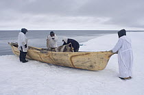 Hopson One whaling crew with skin boat and whaling implements on the edge of a lead in the frozen Chukchi Sea, off Point Barrow, Arctic Alaska