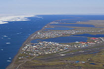 Aerial view of the Inupiat village of Barrow during the Spring ice breakup. National Petroleum Reserves, Arctic coast of Alaska