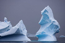 Tall iceberg floating off the western Antarctic peninsula, Antarctica, Southern Ocean