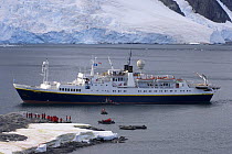 Small inflatable boats ferrying tourists back to a cruise ship along the western Antarctic peninsula, Southern Ocean, 2007