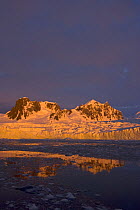 Sunset over the frozen landscape of the western Antarctic peninsula