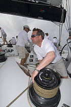 Onboard ICAP "Leopard 3", Richard Faulkner trims the jib upwind during Antigua Race Week 2008, day 1, halfway round the Island Race, Falmouth to Dickenson Bay anti clockwise.