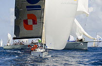 ICAP "Leopard 3" dwarfing another yacht during Antigua Race Week 2008. Day 2, halfway round the Island Race, Dickenson Bay to Falmouth anti clockwise