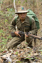 Anti-poaching patrol guard with gun, Alaungdaw Kathapa National Park, north-western Burma (Myanmar)