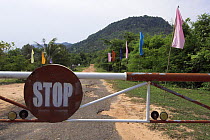 Barrier across road in Preah Monivong Bokor National Park, Elephant Mountains, south-western Cambodia (formerly Kampuchea)