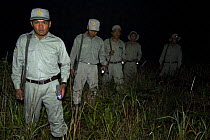 Guards on anti-poaching patrol at night, Preah Monivong Bokor National Park, Elephant Mountains, south-western Cambodia (formerly Kampuchea)