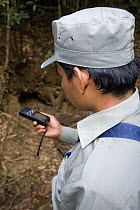 Guard on anti-poaching patrol using GPS to navigate, Preah Monivong Bokor National Park, Elephant Mountains, south-western Cambodia (formerly Kampuchea)