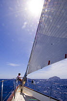 Relaxing in the sun on the bow of SY "Adele", 180 foot Hoek Design, whilst sailing from Antigua to Nevis