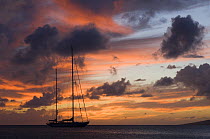 Silhouette of SY "Adele", 180 foot Hoek Design, moored off Saint Kitts at sunset. 2006.  Non editorial uses must be cleared individually.