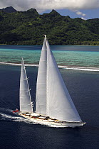 Aerial view of SY "Adele", 180 foot Hoek Design, underway close to the reef off Huahine Island, French Polynesia, 2006.  Non editorial uses must be cleared individually.