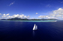 Aerial view of SY "Adele", 180 foot Hoek Design, underway close to the reef off Huahine Island, French Polynesia Non editorial uses must be cleared individually.