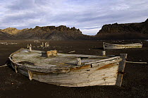 Old whaler boats on the volcanic shore at Whalers Bay, Deception Island, Antarctic Peninsula, January 2007.